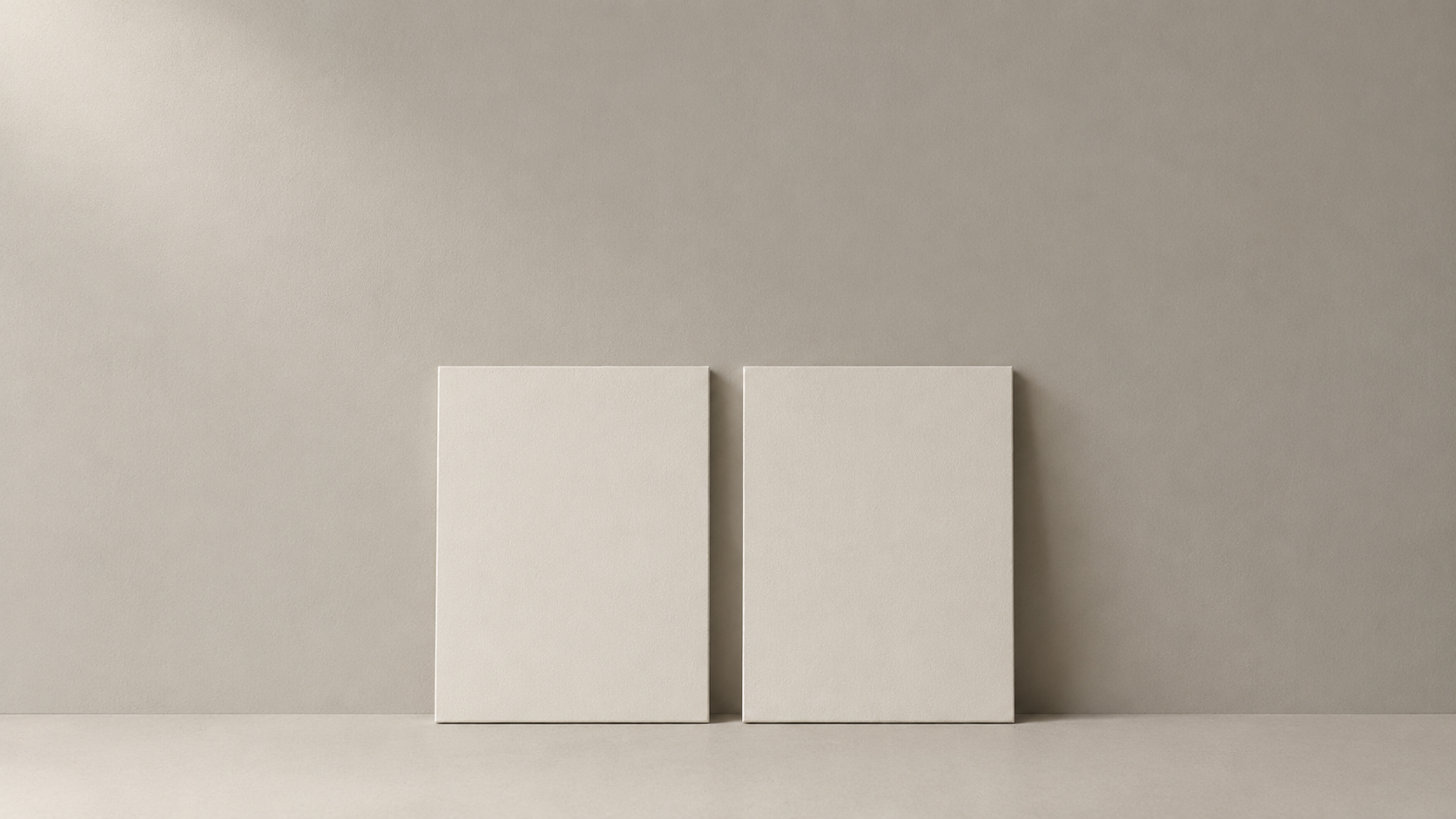 Two identical blank panels propped side by side against a neutral wall for a direct comparison
